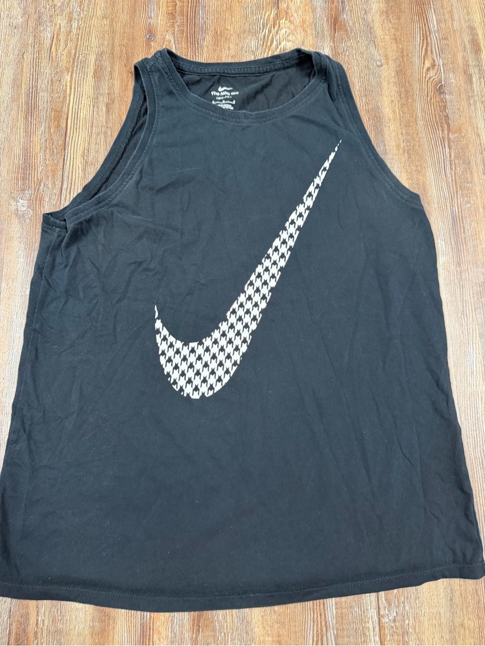 Nike black tank top with white checkered Nike swoosh, size M